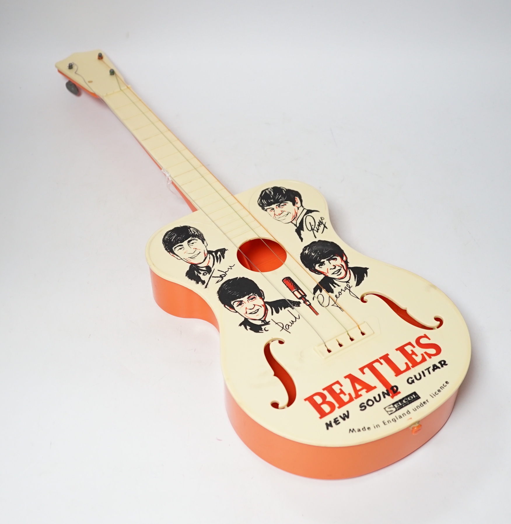 The Beatles plastic toy guitar by Selcol, 59cm